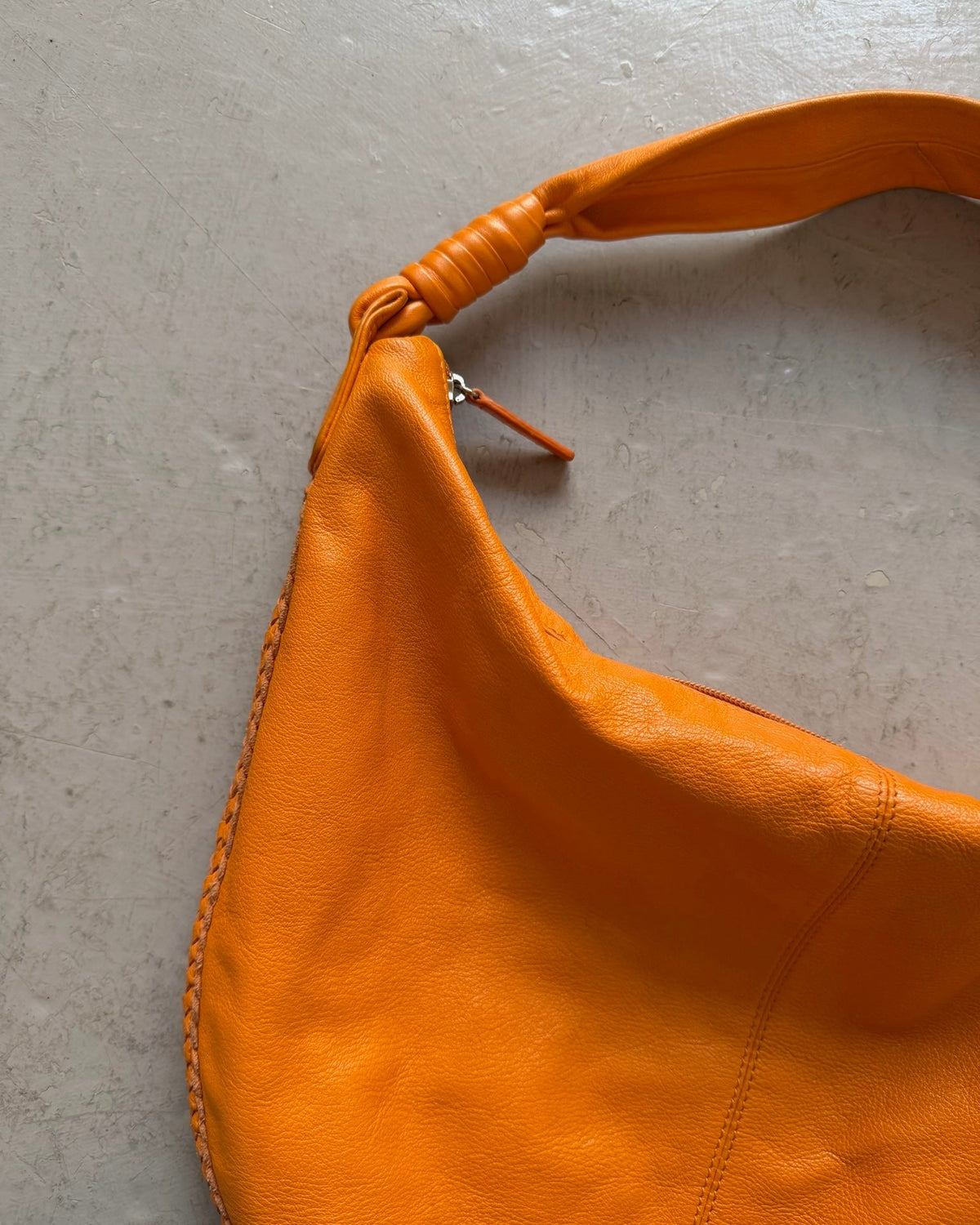 Orange slouchy leather bag
