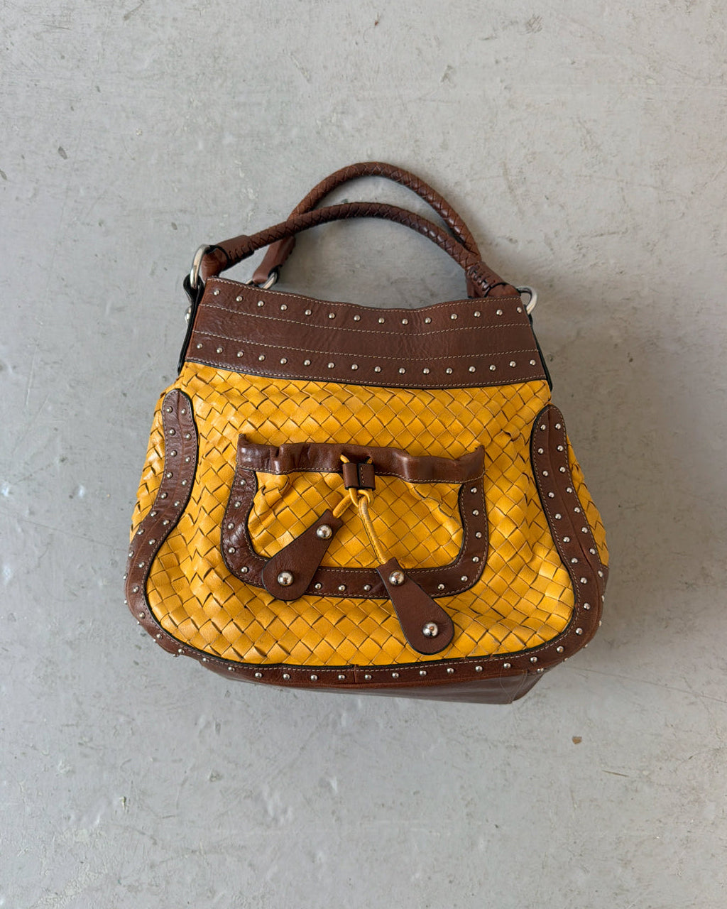 Yellow woven stud bag