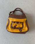 Yellow woven stud bag