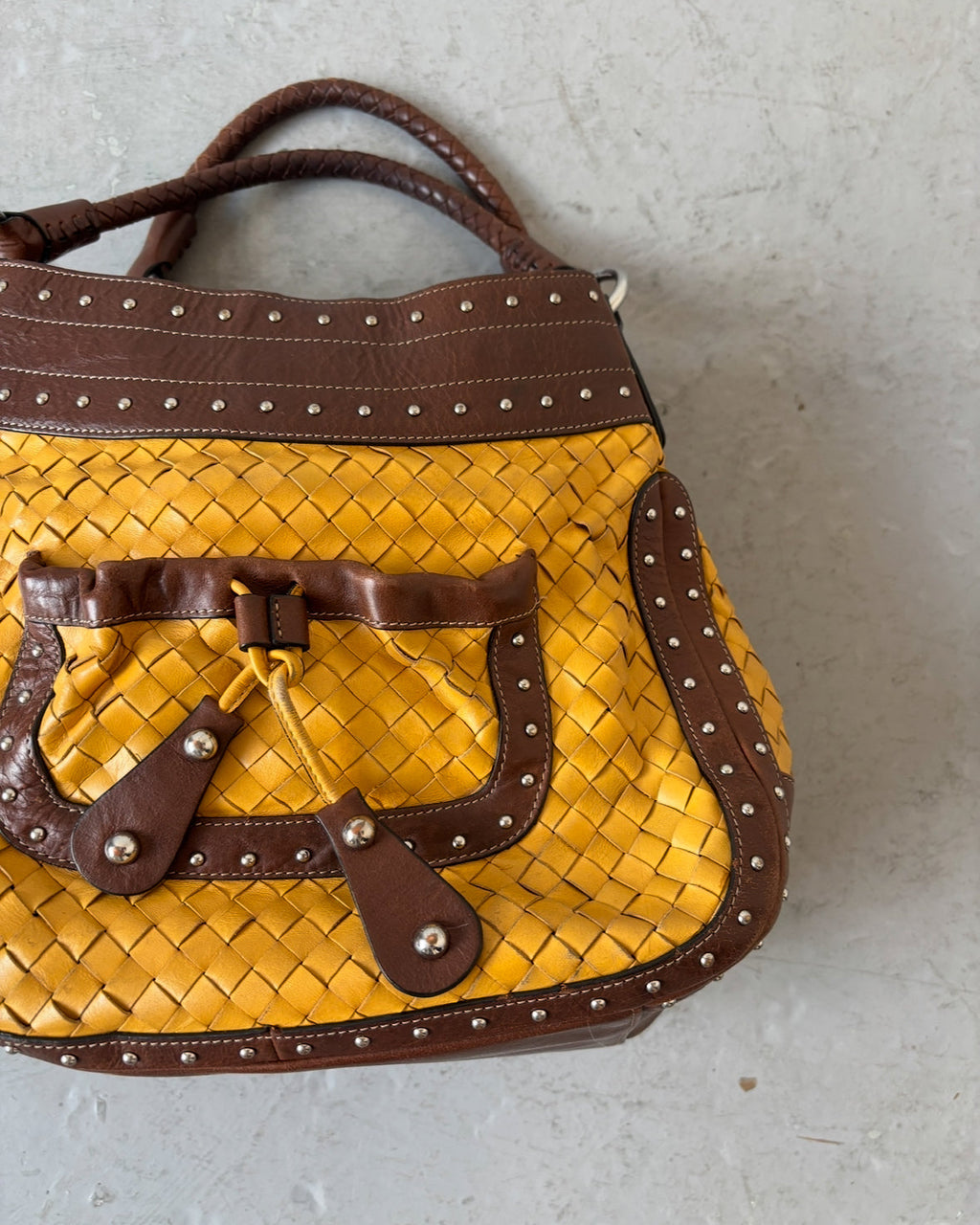 Yellow woven stud bag