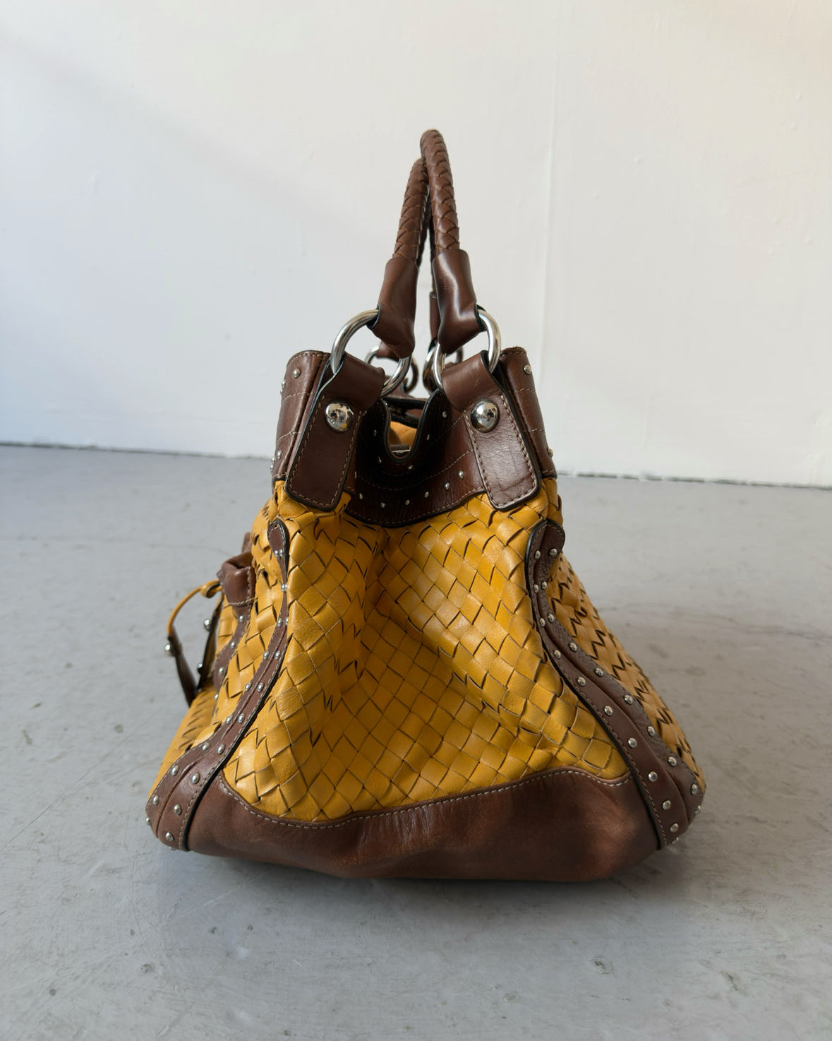 Yellow woven stud bag