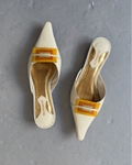 White & orange toned pointed heels