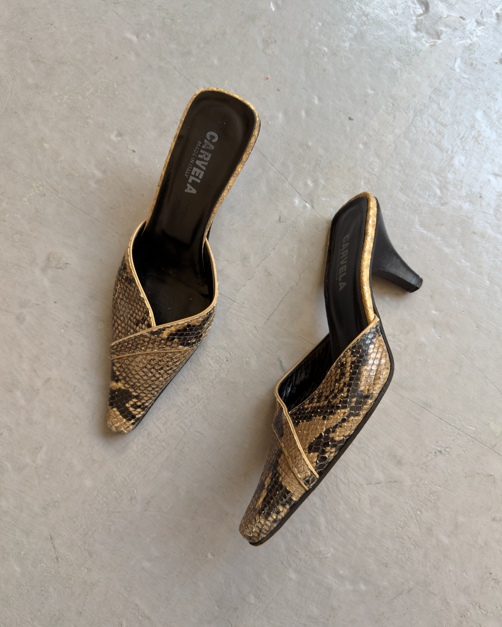 Snakeskin pointed mules